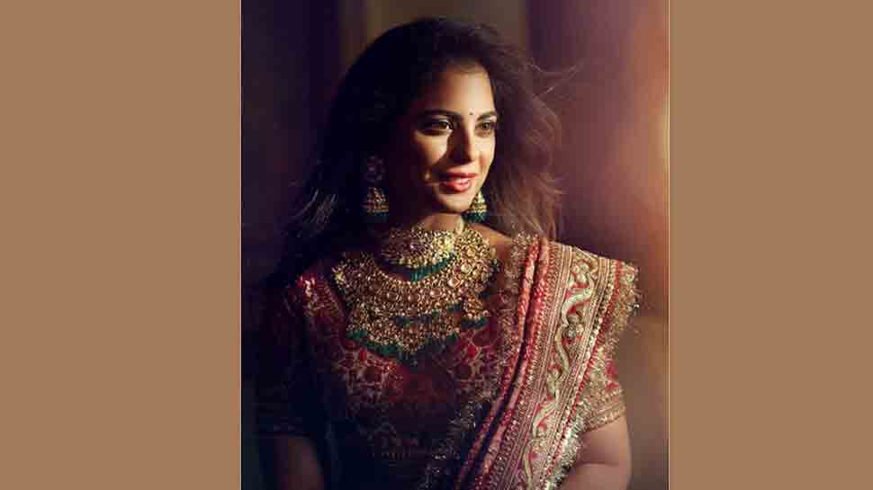 Isha Ambani looks regal in red Sabyasachi lehenga for pre-wedding puja ...