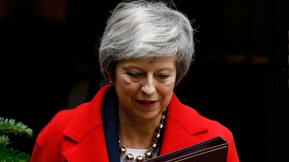 Before Brexit debate, Britain PM Theresa May suffers damaging blow