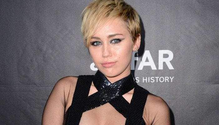 Miley Cyrus sends cat emoji to Grande after split with Davidson