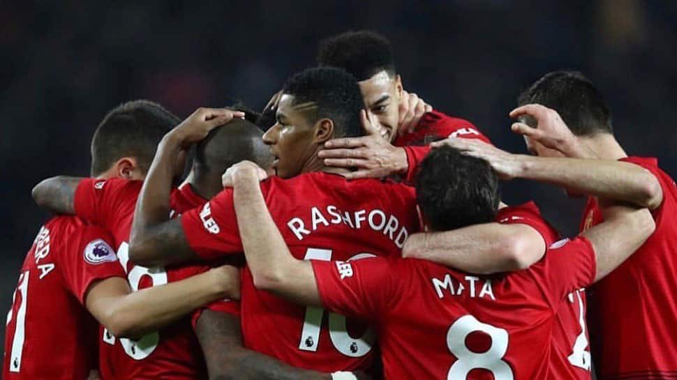 Manchester United beat Reading 2-0 to make FA Cup progress, Chelsea through