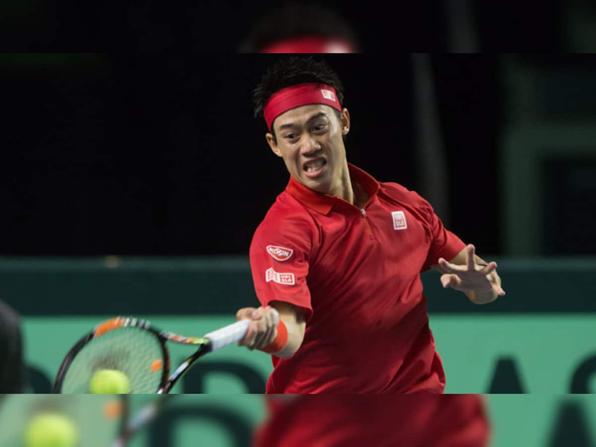 Australian Open Kei Nishikori reaches second round after Kamil