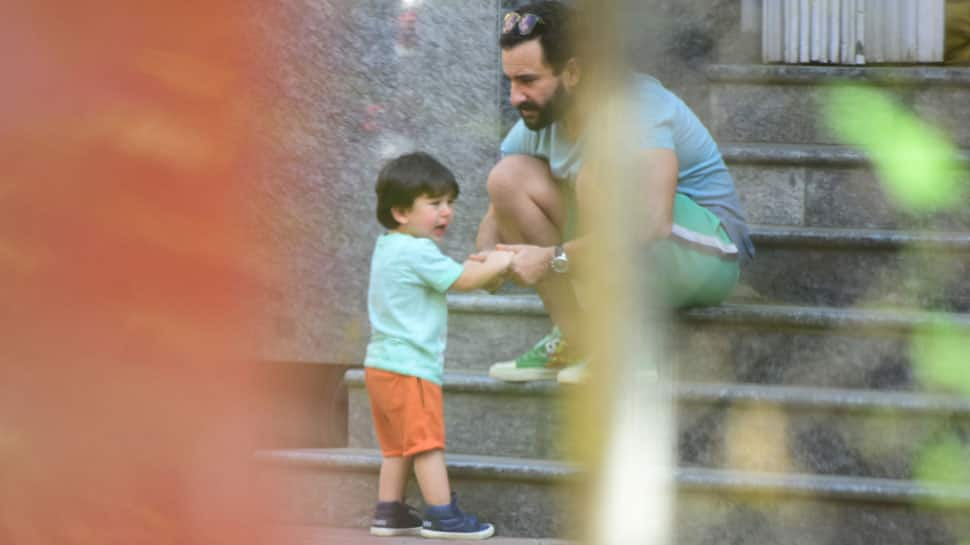 What is it that Taimur wants from daddy cool Saif Ali Khan in these pics?