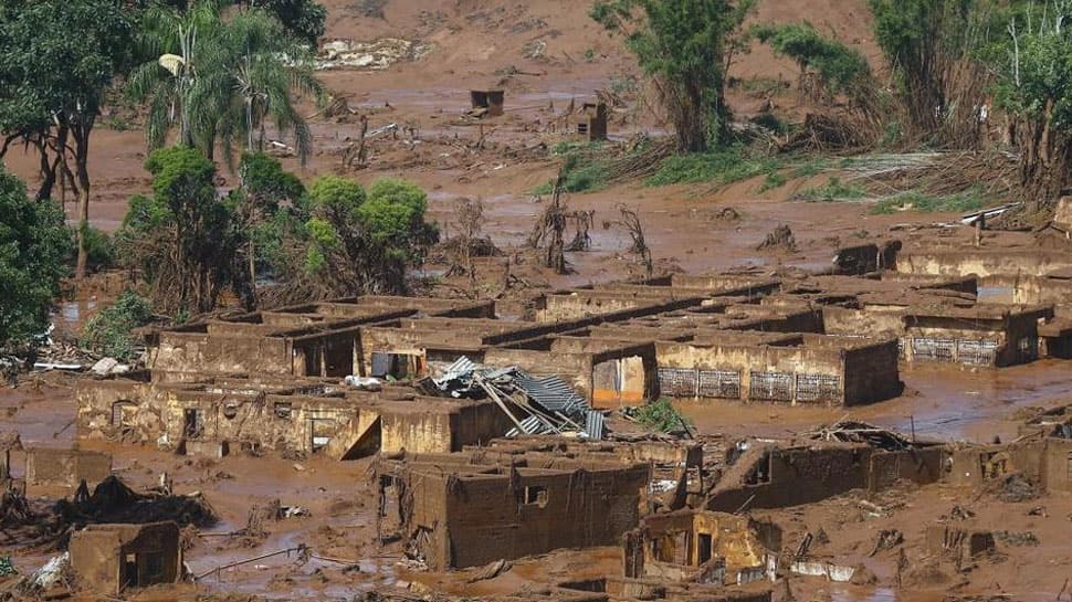 Seven bodies found after dam burst at Brazil mine, hundreds missing