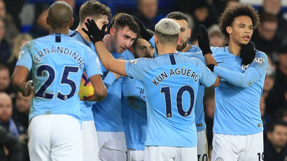 Manchester City go top of the Premier League with win at Everton