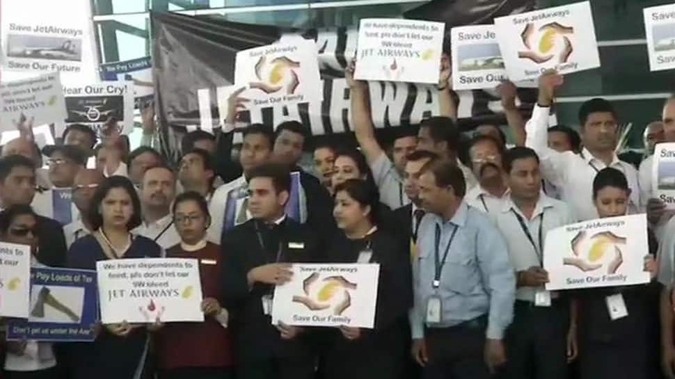 Jet Airways&#039; employees protest outside Delhi airport over delay in payment