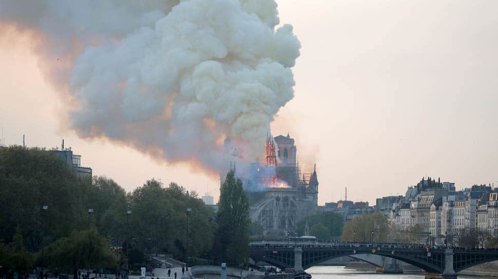 Fire guts Notre-Dame Cathedral in Paris, French President Emmanuel Macron pledges to rebuild