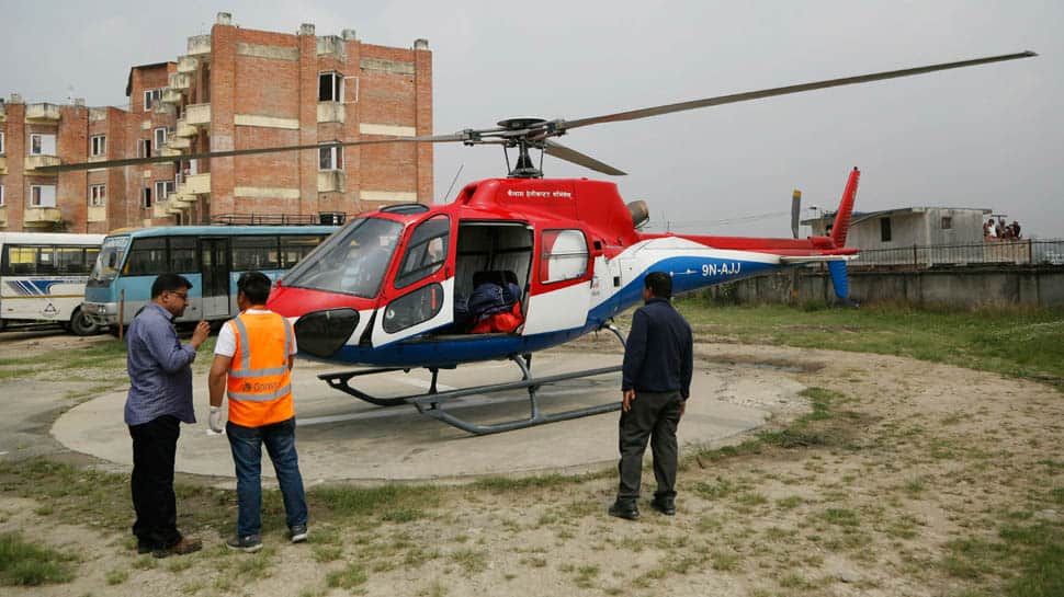 Nepal plane hits parked helicopter while taking off, killing three