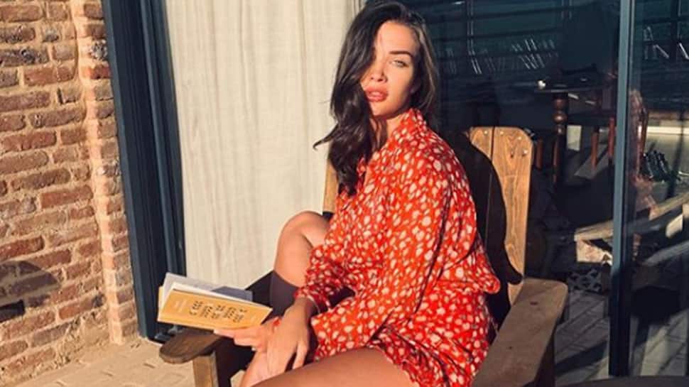 Preggers Amy Jackson flaunts her baby bump, looks radiant in tangerine dress—See pic
