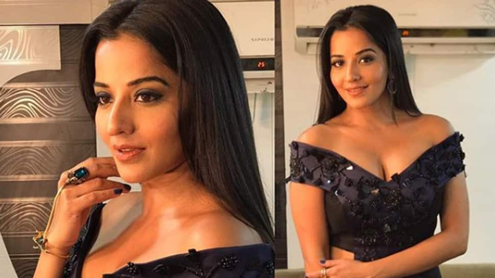 Monalisa strikes a pose in a floral dress with a plunging neckline—See pic