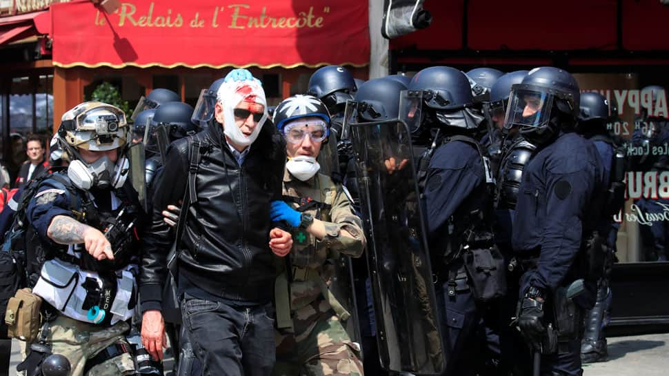 Riot police, masked protesters clash at Paris May Day rally