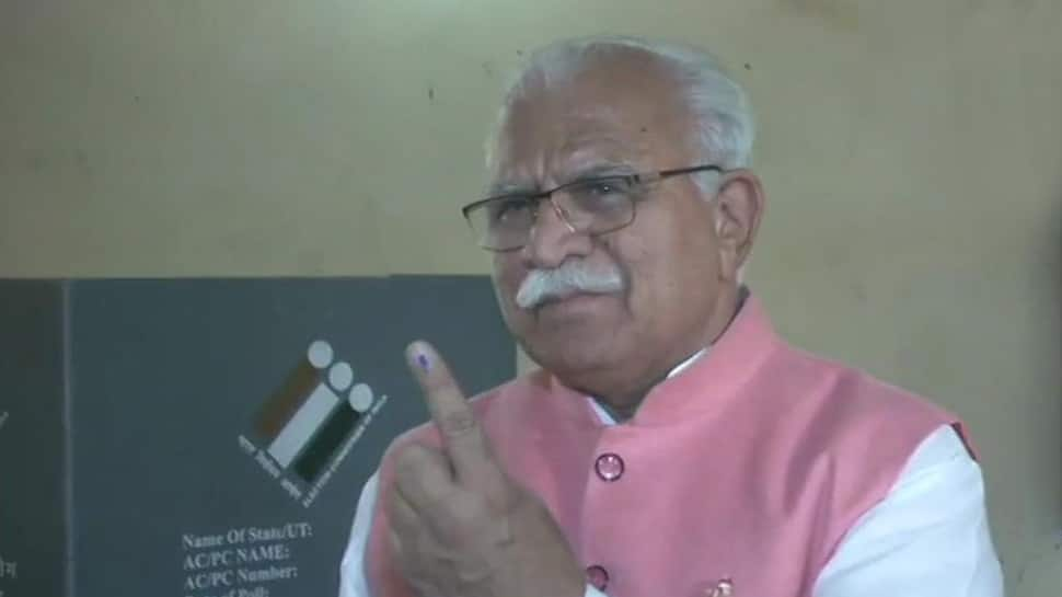 Haryana CM Manohar Lal Khattar takes train to Karnal to vote