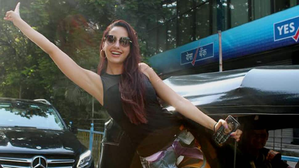 Nora Fatehi enjoys an auto ride in Bandra—Pics