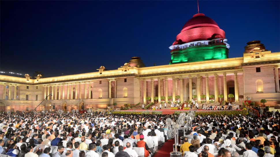 White kurta-pyjama with hues of saffron and Hindi language dominating themes at swearing-in ceremony