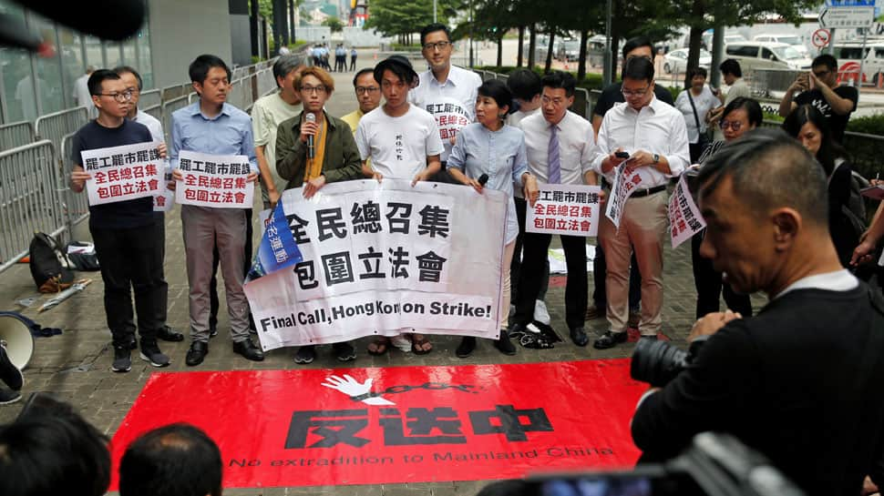 Protesters scuffle with Hong Kong police, government offices shut