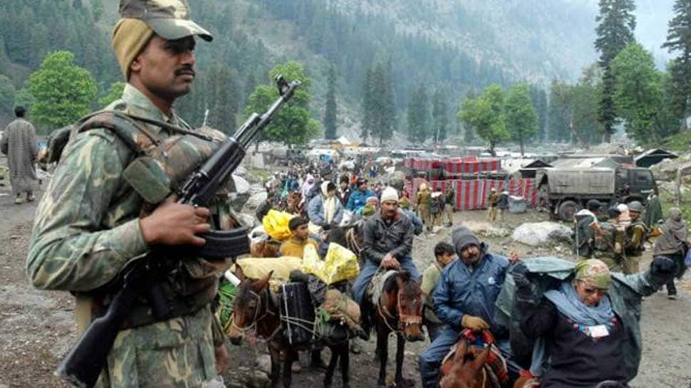 Image result for Around 40,000 security personnel were deployed to guard the pilgrimage to the Amarnath cave temple.