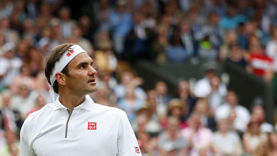 Roger Federer survives first-set wobble to down Wimbledon debutant