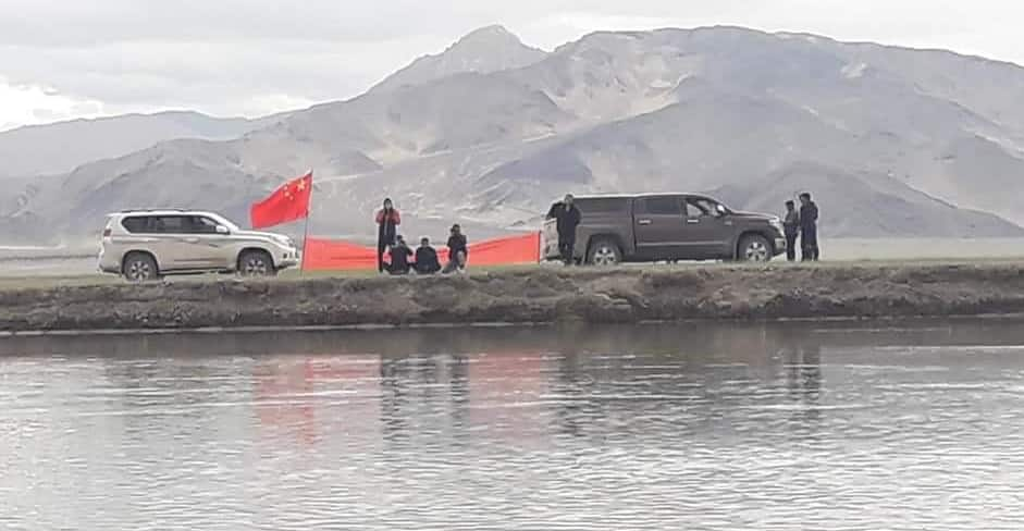 Chinese Army men in &#039;civilian clothes&#039; show banner supporting Tibet to villagers in Ladakh