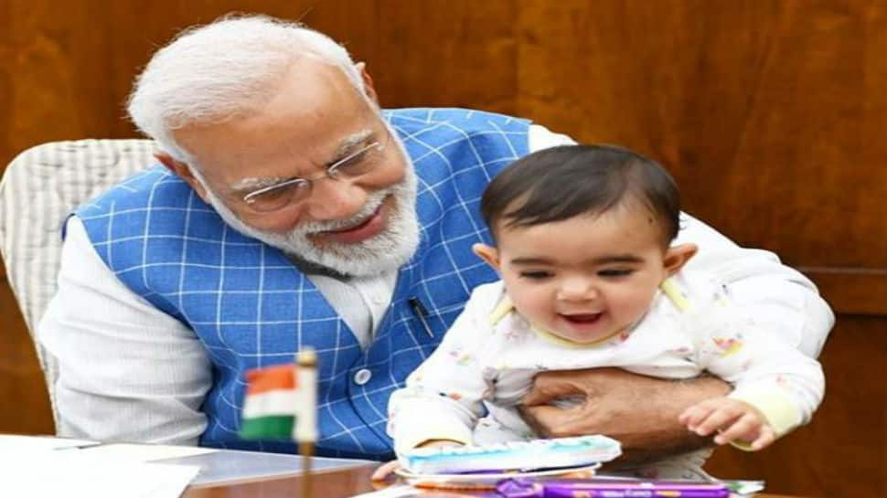 Photos of PM Narendra Modi playing with baby in Parliament go viral