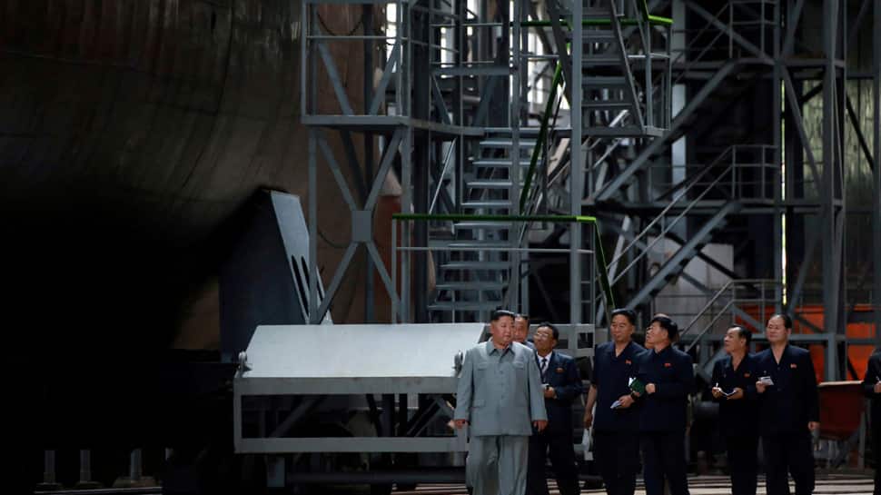 North Korean leader Kim Jong Un inspects new submarine, signals possible ballistic missile development