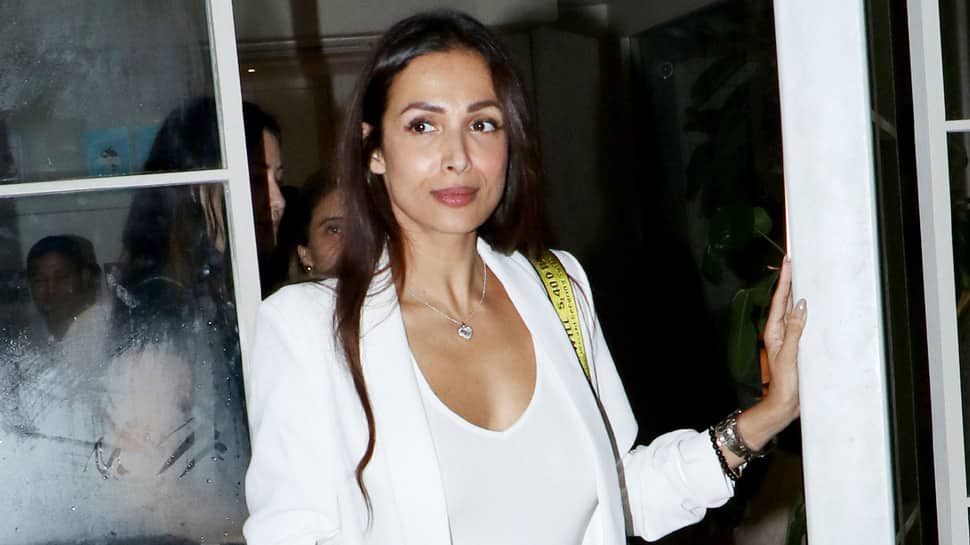 Malaika Arora looks uber chic in a top with plunging neckline—Pics 