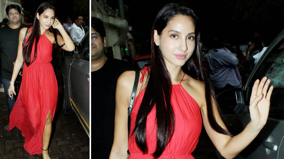 Nora Fatehi slays in a ravishing red gown with a slit—Photos