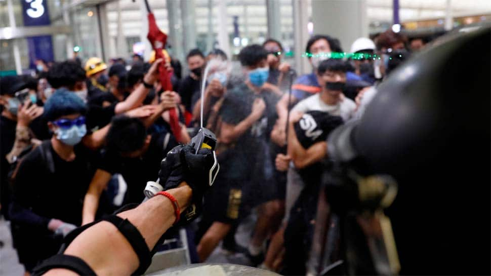 Hong Kong airport reopens after overnight clashes, hundreds of flights rescheduled