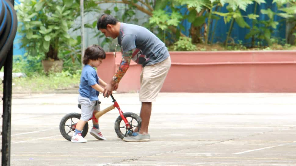 Taimur Ali Khan learns how to ride a bicycle and these pics are beyond cute!