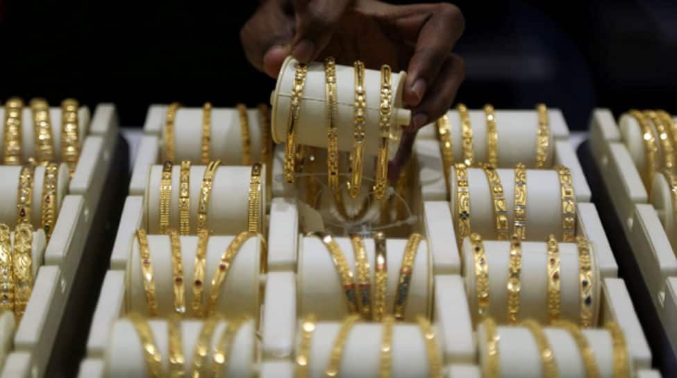 Gold passes $1,550 for first time in over six years on trade jitters