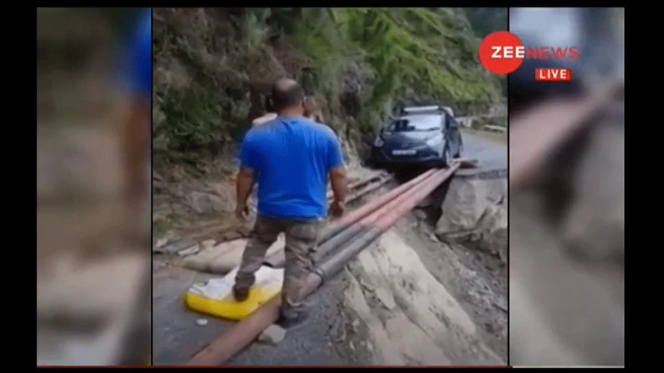 Video shows car crossing washed out road on iron pipes in Himachal Pradesh&#039;s Chamba