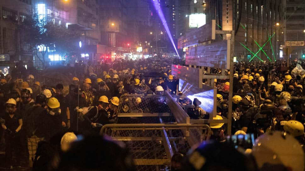 Hong Kong commercial centres paralysed as protesters, police exchange petrol bombs and tear gas