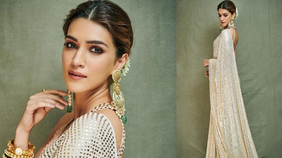 Kriti Sanon looks beautiful in a sequin saree for Ganesh Chaturthi celebrations—Pics