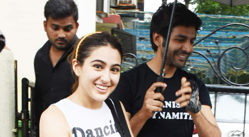 Kartik Aaryan holds an umbrella for Sara Ali Khan amid smiles, laughter and rain! See pics