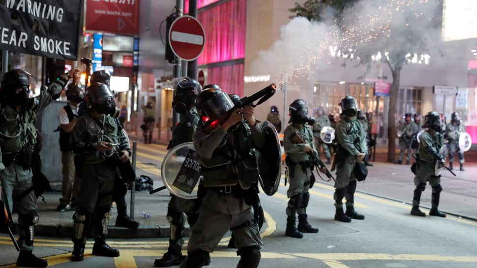 Hong Kong reopens after violent weekend of clashes and protests