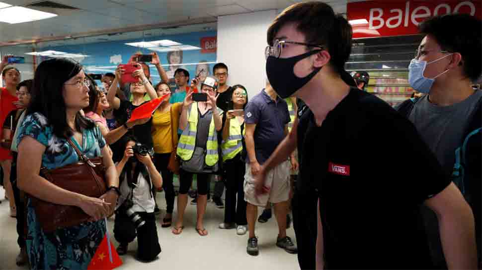 Pro-Beijing groups tear down Hong Kong&#039;s protest walls, raising risk of clashes