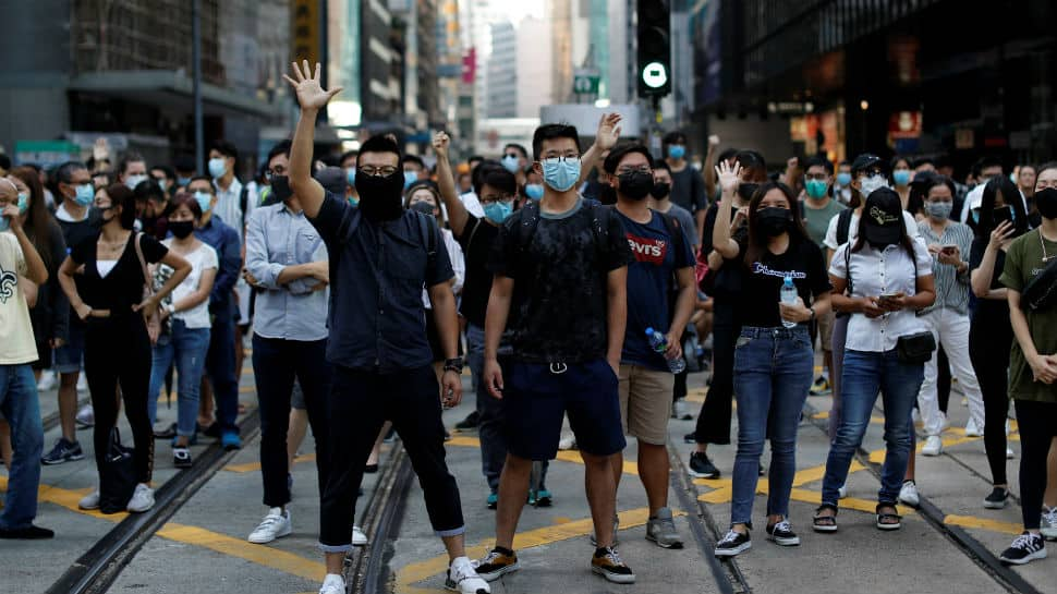 Hundreds return to Hong Kong streets as metro, shops shut after violence