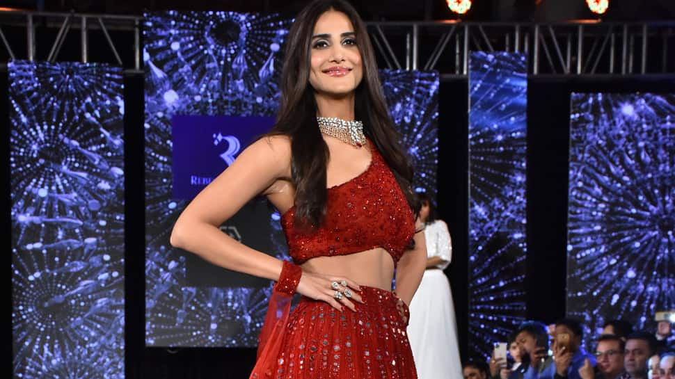 Belle of the ball! Vaani Kapoor walks the ramp in a red lehenga—Pics