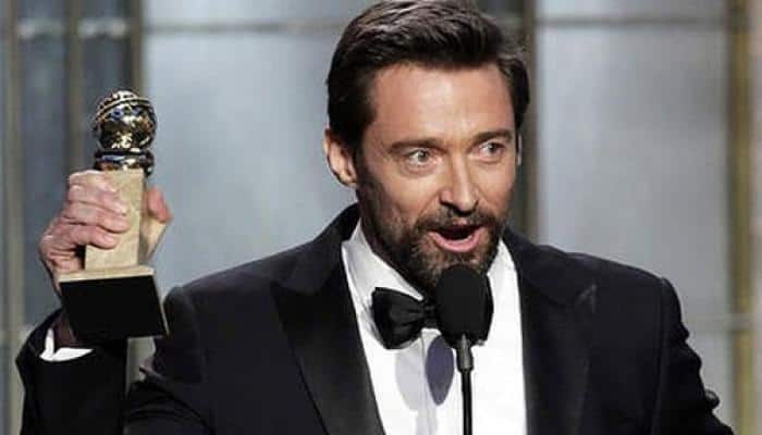 Hugh Jackman spotted hailing a cab in New York