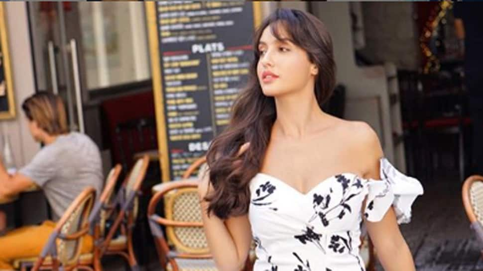 Nora Fatehi mesmerises in a floral dress with a thigh-high slit—Pics