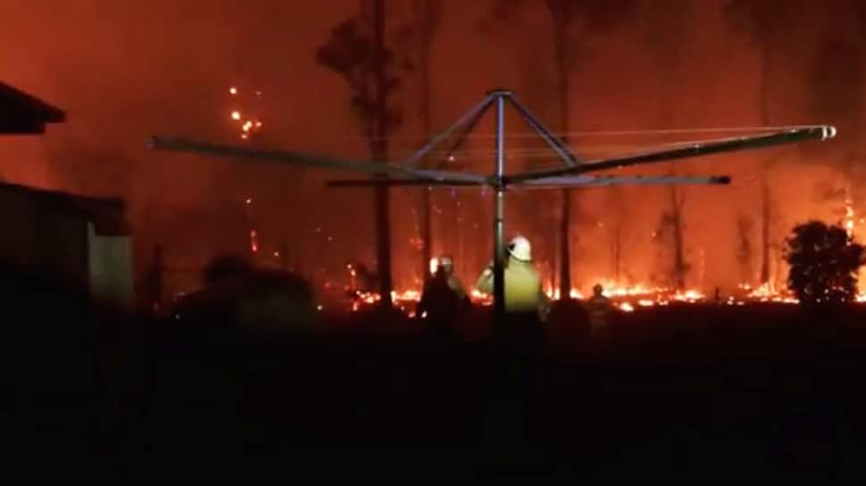 Australia orders evacuations as firefighters struggle to contain bushfires