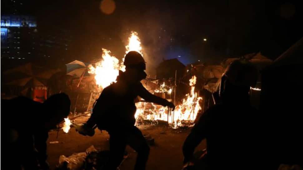Hong Kong campus protesters fire arrows as unrest spreads across Kowloon