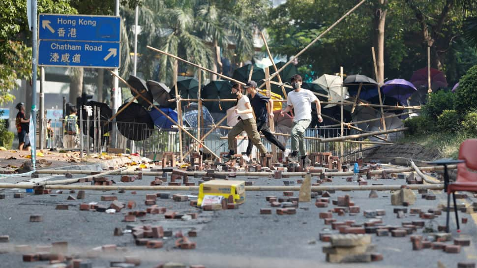 Hong Kong campus holdouts desperately seek escape routes