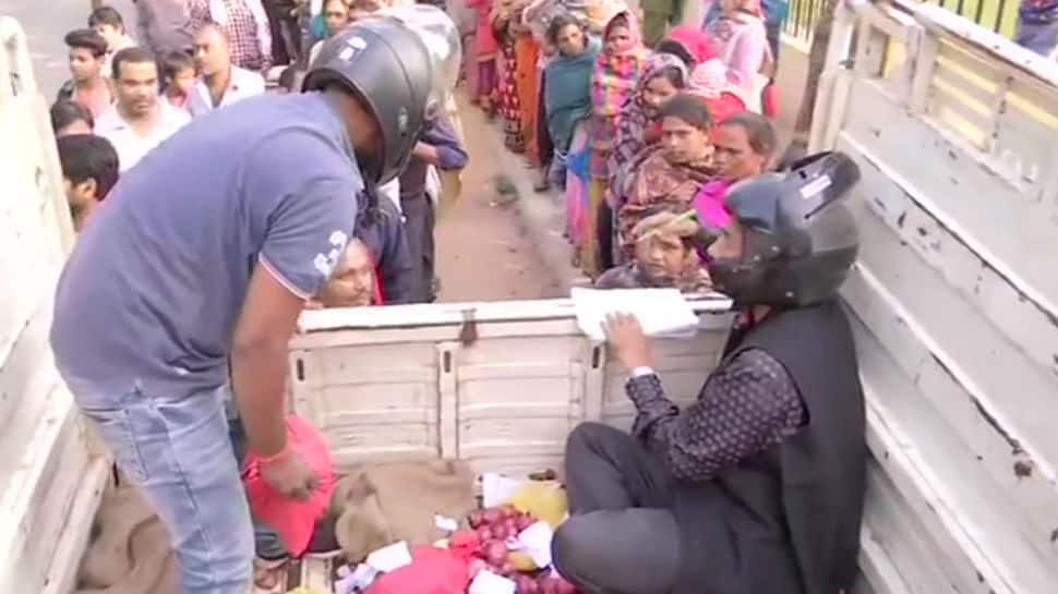 Fearing stampede, Patna officials wear helmets while selling onion for Rs 35/kg