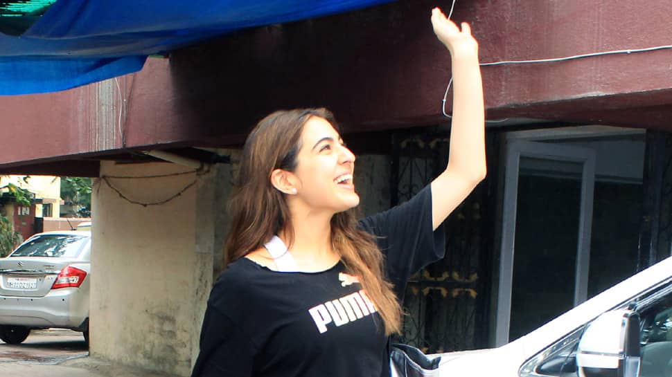 Sara Ali Khan flashes her million-dollar smile as paps click her at gym – Photos