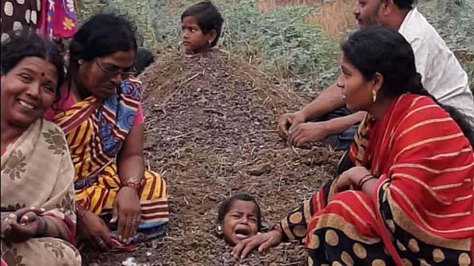 During Solar Eclipse disabled children buried neck-deep in sand at Kalburgi