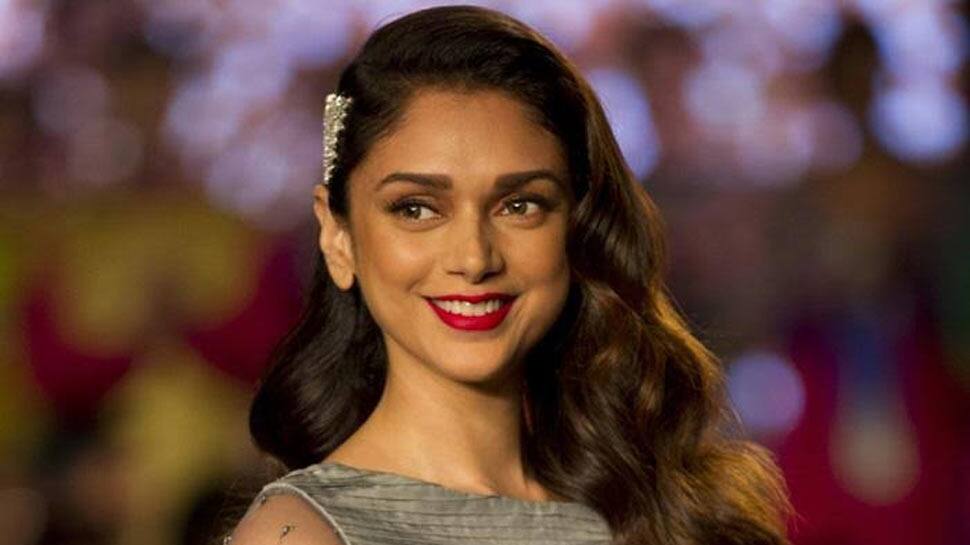 Aditi Rao Hydari admires paintings at India Art Festival