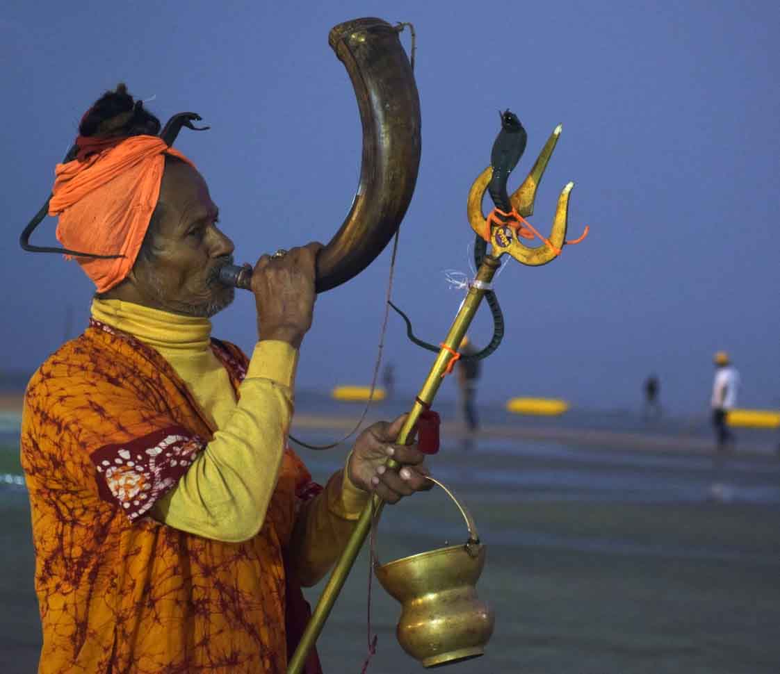 Hermit playing traditional musical instrument