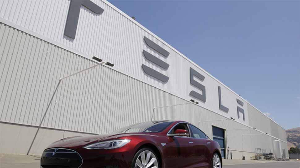 Tesla extends profit run, promises record production, driving stock up 13%