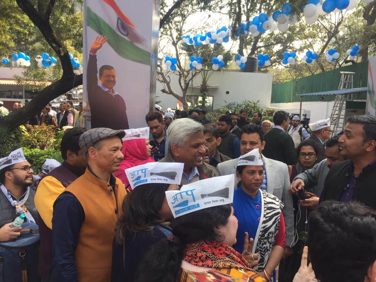 AAP supporters gather in front of the party office