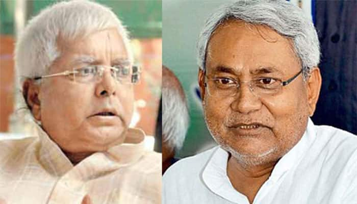 RJD releases poster calling Bihar CM Nitish Kumar &#039;shikari&#039;, JD(U) hits back with &#039;Thugs of Bihar&#039; jibe