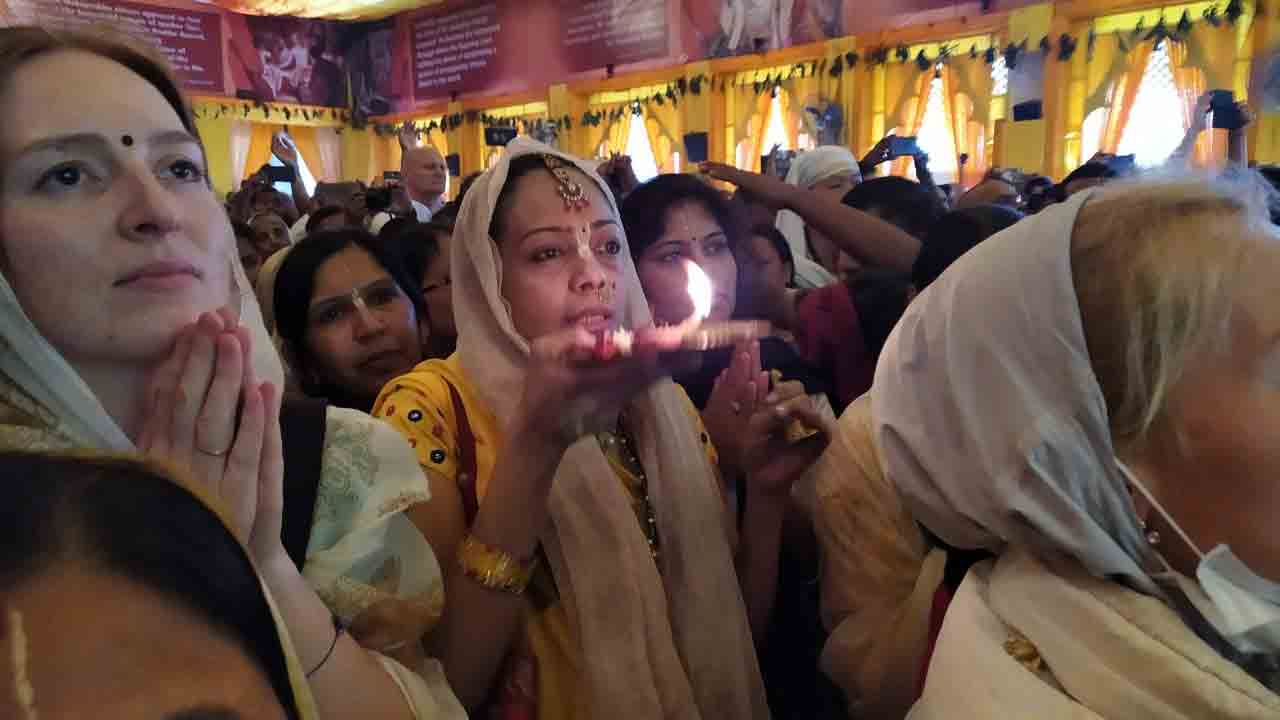 Devotees perform aarti in Mayapur's Iscon Temple